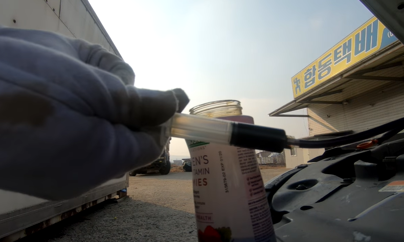 Drain a Small Amount of Engine Oil