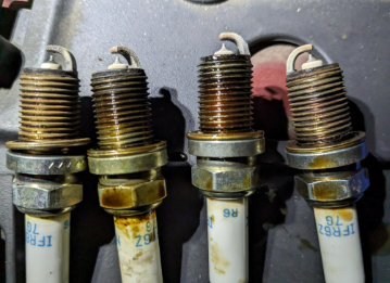 How to Get Oil Out of Spark Plug Well?