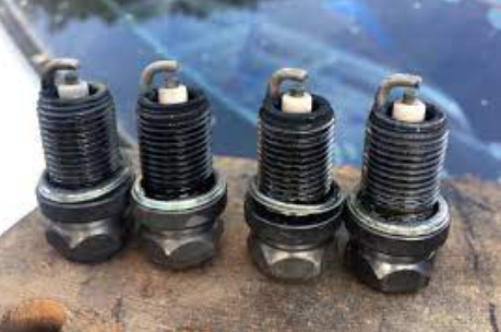 Get Oil Out of Spark Plug Well?